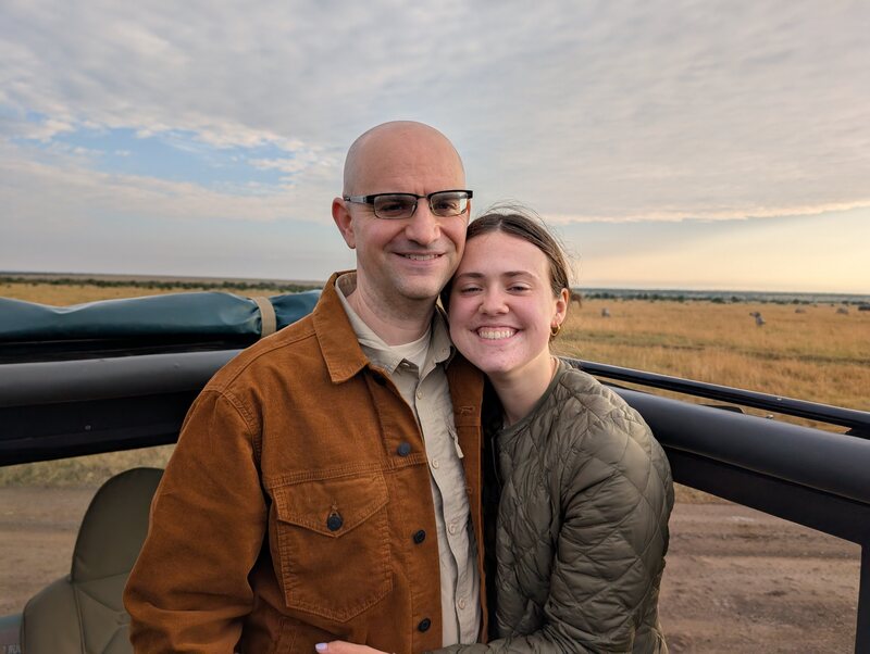Peter and Malia in truck near giraffes